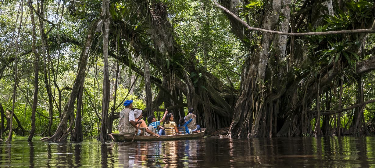 Tourists sailing on the river in the Peruvian Amazon